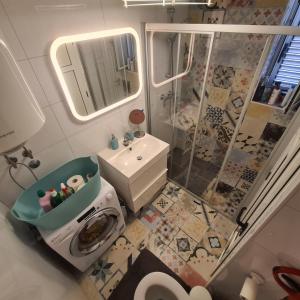 a bathroom with a shower and a toilet and a sink at Apartment Summer Joy in Supetar