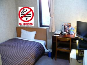 Postel nebo postele na pokoji v ubytování Matsue Urban Hotel Lake Inn