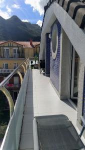 a balcony of a building with a skateboard on it at Oriñon Beach Apartment in Oriñón