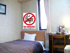 Postel nebo postele na pokoji v ubytování Matsue Urban Hotel Lake Inn