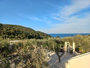 a view of the ocean from a house at HMO Glamping & Suites in Vignanotica in Mattinata