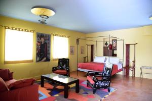 a living room with a bed and a couch at HMO Glamping & Suites in Vignanotica in Mattinata