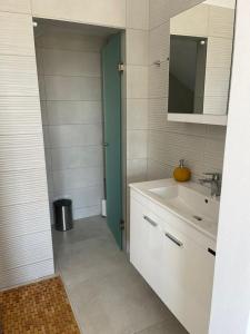 a bathroom with a sink and a mirror at Villa Aspria in Rethymno