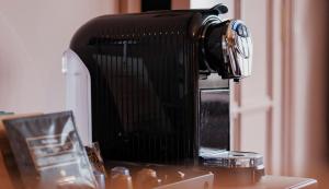 a coffee maker sitting on top of a counter at Fisherman's Haunt Hotel in Christchurch