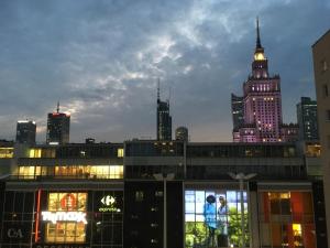 a view of a city skyline with a tall building at ComeWa Apartments in Warsaw