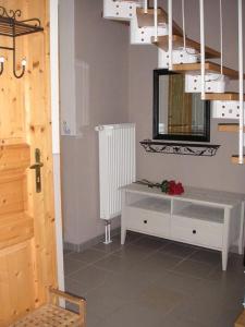 a room with a white cabinet and a mirror at Blockstube in Rammenau +11 photos