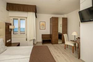 Postel nebo postele na pokoji v ubytování Hotel Adria sul Mare + 37 fotografií