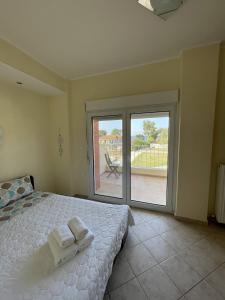 Postel nebo postele na pokoji v ubytování Makis Nest Apart-Hotel