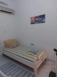Posteľ alebo postele v izbe v ubytovaní Jaana & Akis Holiday Home 1&2, Haraki