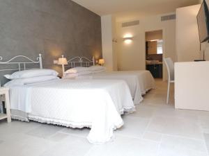 Postel nebo postele na pokoji v ubytování Hotel Giardino Suites&Spa