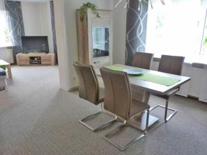 a dining room with a table and chairs at Ferienwohnung "Christine" Objekt ID12096-8 in Waren