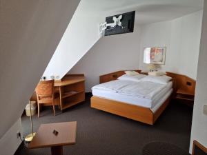Ein Bett oder Betten in einem Zimmer der Unterkunft Hotel Gerberhof