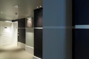 a hallway with black walls and a white door at Hotel Piccolo Portofino in Portofino