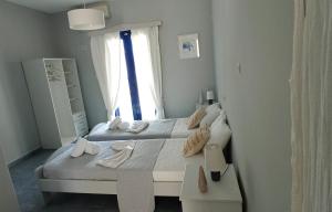 Postel nebo postele na pokoji v ubytování Allegria Family Hotel