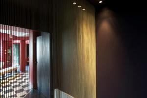 a room with a wall with a mirror and a window at Hotel Piccolo Portofino in Portofino