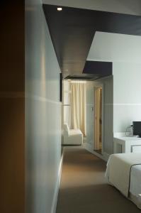 a bedroom with two beds and a black ceiling at Hotel Piccolo Portofino in Portofino