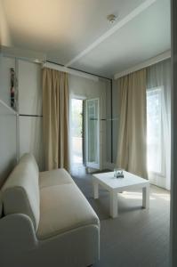 a living room with a couch and a table at Hotel Piccolo Portofino in Portofino