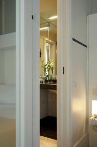 a bathroom with a sink and a mirror at Hotel Piccolo Portofino in Portofino