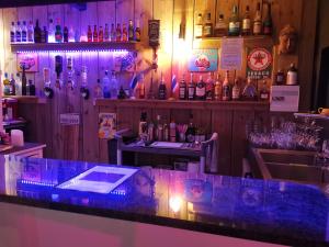 a bar with blue lights on the counter at Hostal 170 Room 15 Service Appartement in Le Tampon