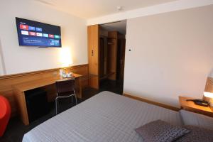 Postel nebo postele na pokoji v ubytování Hotel Europa Belluno
