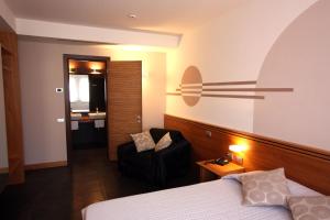 Postel nebo postele na pokoji v ubytování Hotel Europa Belluno