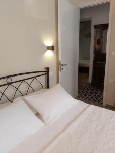 A bed or beds in a room at Mid century character house in Argostoli
