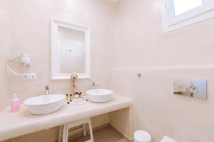Kúpeľňa v ubytovaní Naxian Emerald Hotel