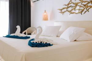Posteľ alebo postele v izbe v ubytovaní Naxian Emerald Hotel