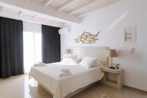 Posteľ alebo postele v izbe v ubytovaní Naxian Emerald Hotel