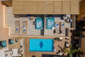an overhead view of a resort with a swimming pool at Palmera Beach Hotel & Spa - Adults Only in Hersonissos