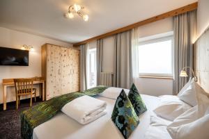 Postel nebo postele na pokoji v ubytování Hotel Schmung