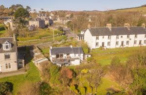 an aerial view of a house in a village at Rowan Cottage at Kames in Kames