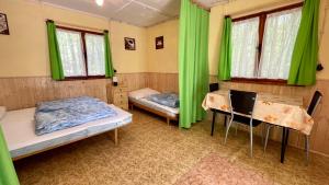 Postel nebo postele na pokoji v ubytování Chatový areál ATLAS