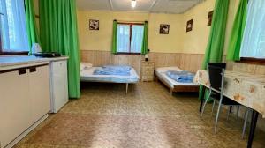 Postel nebo postele na pokoji v ubytování Chatový areál ATLAS