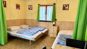 Postel nebo postele na pokoji v ubytování Chatový areál ATLAS