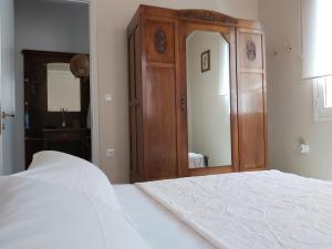 A bed or beds in a room at Mid century character house in Argostoli