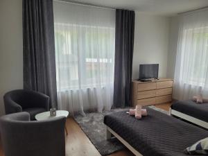 Postel nebo postele na pokoji v ubytování Apartman centrum v súkromí Reštaurácia U Jakuba