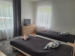 Postel nebo postele na pokoji v ubytování Apartman centrum v súkromí Reštaurácia U Jakuba