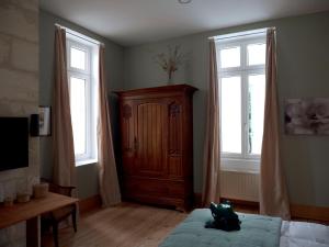 Łóżko lub łóżka w pokoju w obiekcie Château Fleur D'Aya