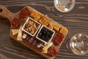 a tray of different types of food on a table at Il Pradicciolo Agriturismo in Castelnuovo di Garfagnana