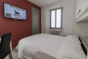 Postel nebo postele na pokoji v ubytování Residence Il Muretto