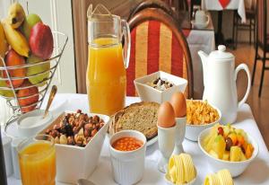 a table topped with breakfast foods and drinks on a table at Fitzwilliam Townhouse in Dublin +25 photos