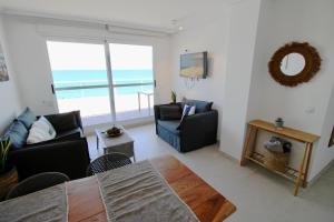 a living room with a view of the ocean at Mirador al Mar 32 in Denia