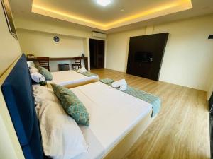 FIG Sunset View Resort客房内的一张或多张床位