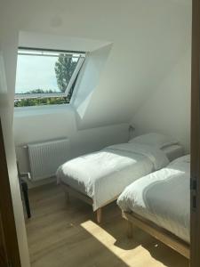 Llit o llits en una habitació de Le Gîte du Flot - Baie de Somme