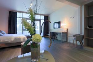 TV a/nebo společenská místnost v ubytování Chez Maman Hotel & Restaurant