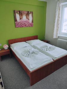 Posteľ alebo postele v izbe v ubytovaní BEST Hotel Garni