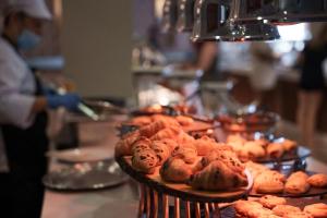 a table with a bunch of pastries on at Pavlo Napa Beach Hotel in Ayia Napa