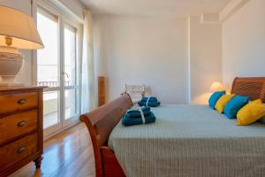 A bed or beds in a room at Maison Jolie