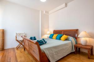 A bed or beds in a room at Maison Jolie